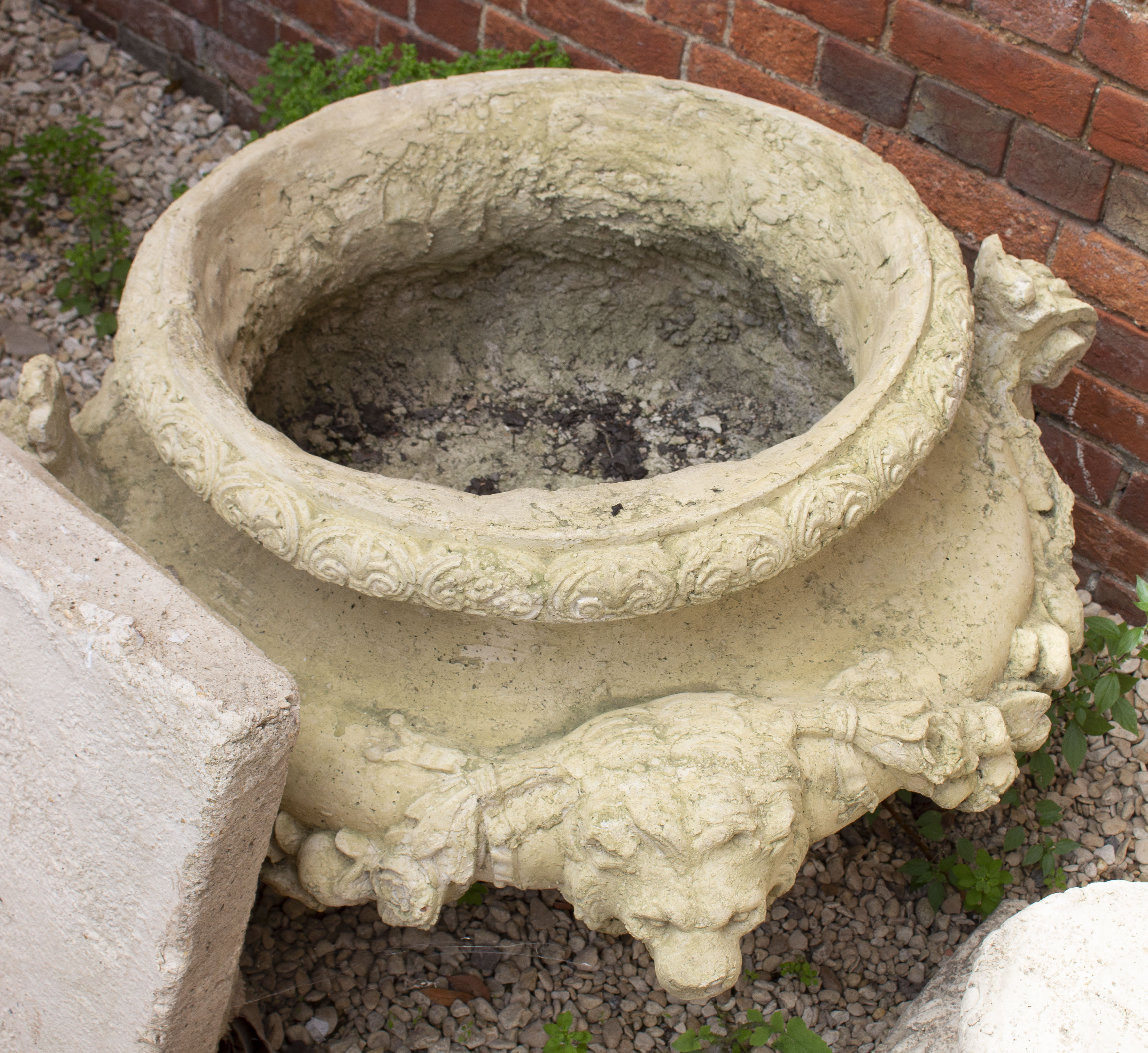 A LARGE CAST RECONSTITUTED STONE BAROQUE STYLE GARDEN URN decorated with lion masks and floral