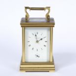 GERALD NASH OF CAVERSHAM brass cased repeater carriage timepiece with bevelled glass and Roman