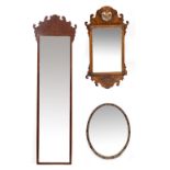 A GEORGIAN STYLE MAHOGANY TALL NARROW WALL HANGING MIRROR with fretwork decoration and bevelled