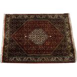 A MIDDLE EASTERN BIDJAR POLYCHROME RUG 113cm x 151cm together with a Turkish blue and red ground