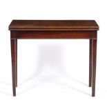 A GEORGE III MAHOGANY FOLD OVER TEA TABLE standing on square tapering legs, 92cm wide x 45.5cm