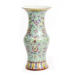A CHINESE TURQUOISE GROUND PORCELAIN VASE with flaring rim and wax seal beneath, 17.5cm diameter x