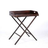A 19TH CENTURY MAHOGANY BUTLER'S TRAY with folding stand, the tray 69cm wide x 46cm deep x 84.5cm