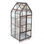 A WROUGHT IRON GLAZED MINIATURE GREEN HOUSE OR FERN HOUSE with twin doors to the front and single