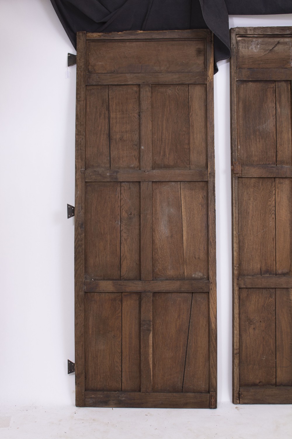 A PAIR OF OAK PANELLED DOORS with butterfly hinges, each door 70cm wide x 190.5cm high Condition: - Image 2 of 8