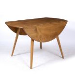 AN ERCOL STYLE ELM TOPPED DROP LEAF KITCHEN TABLE with four beechwood square tapering splaying legs,