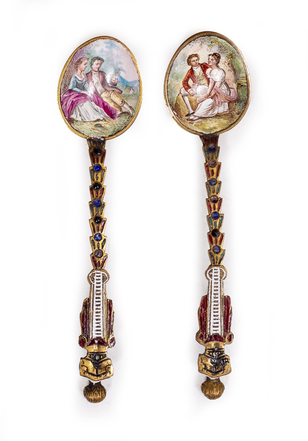 TWO CONTINENTAL ENAMELLED APOSTLE SPOONS each with classical decoration, 12cm in length Condition: