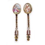 TWO CONTINENTAL ENAMELLED APOSTLE SPOONS each with classical decoration, 12cm in length Condition: