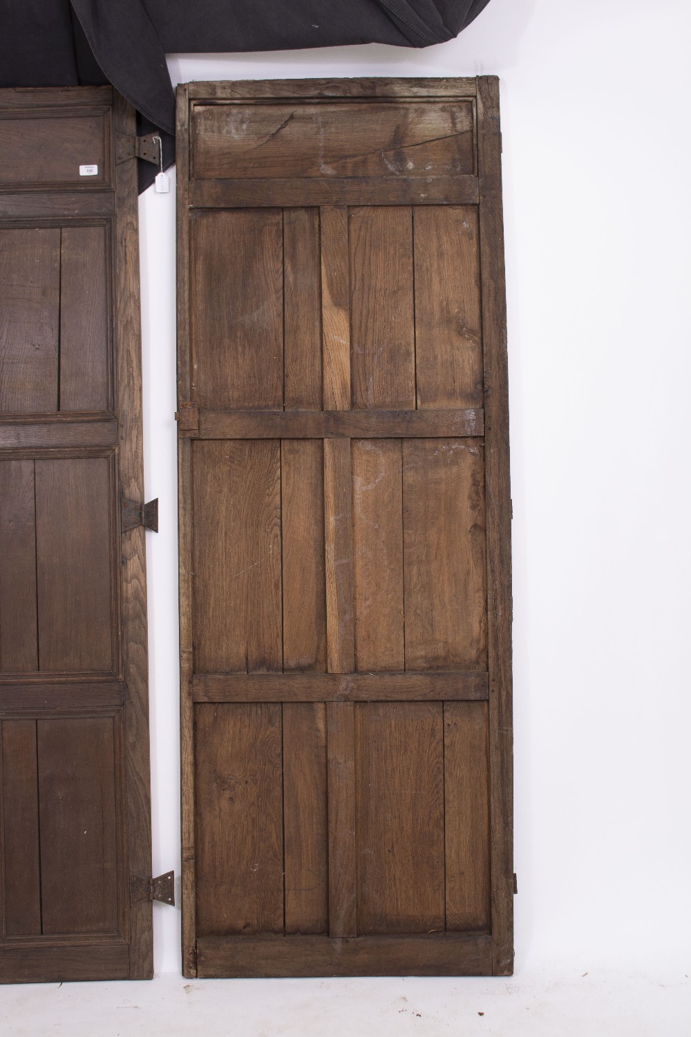 A PAIR OF OAK PANELLED DOORS with butterfly hinges, each door 70cm wide x 190.5cm high Condition: - Image 3 of 8