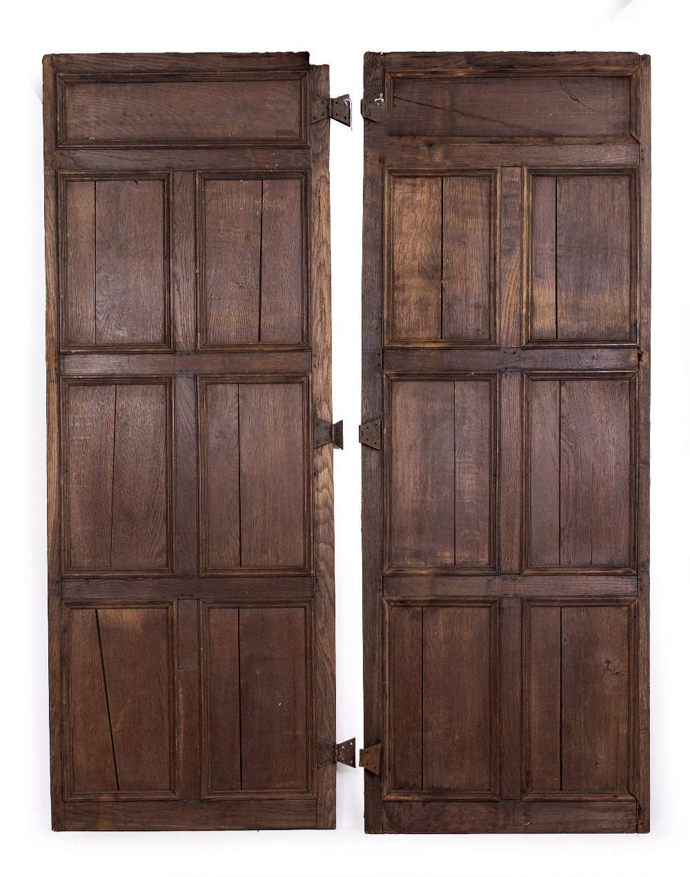 A PAIR OF OAK PANELLED DOORS with butterfly hinges, each door 70cm wide x 190.5cm high Condition: