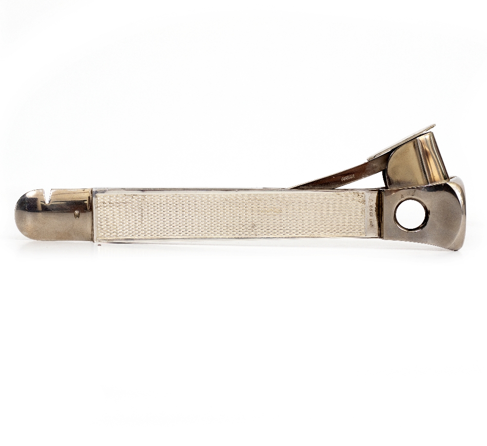 A STEEL AND SILVER MOUNTED CIGAR CUTTER with dates for Birmingham 1987 and makers mark B & M, 15.2cm