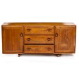AN ERCOL LIGHT ELM SIDEBOARD CABINET with three central drawers flanked by cupboards, 156cm wide x