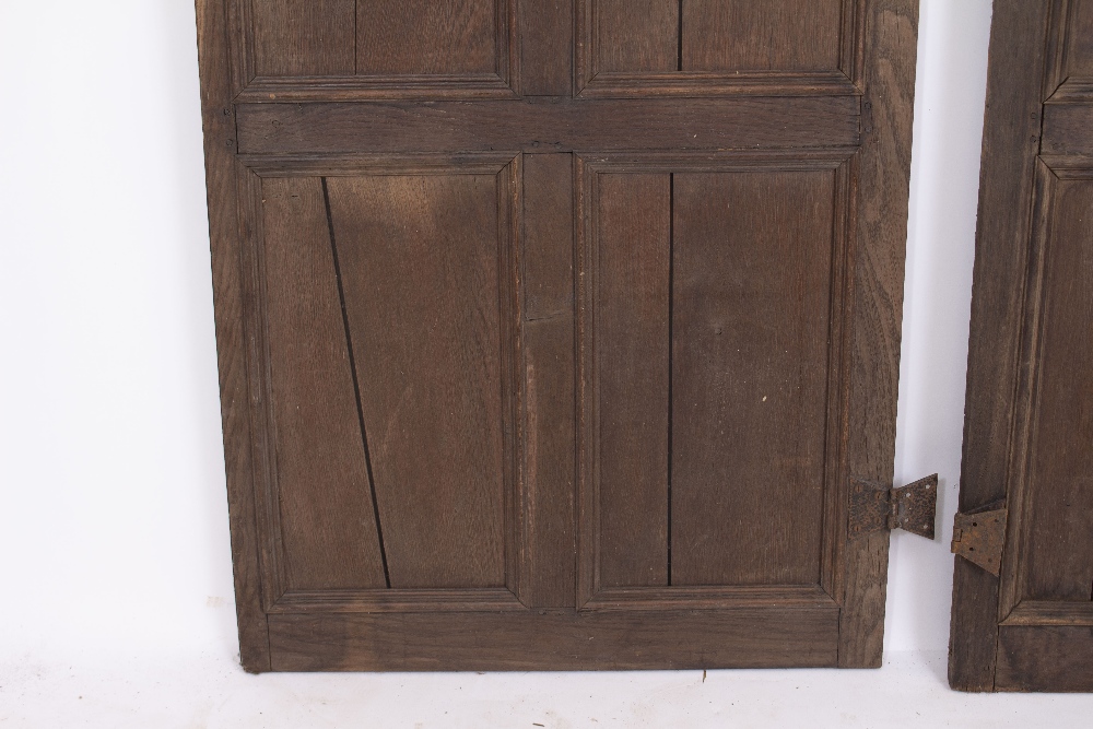 A PAIR OF OAK PANELLED DOORS with butterfly hinges, each door 70cm wide x 190.5cm high Condition: - Image 6 of 8