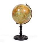 A GEOGRAPHIA 10 INCH TERRESTRIAL GLOBE with a brass half ring mount and turned ebonised wooden