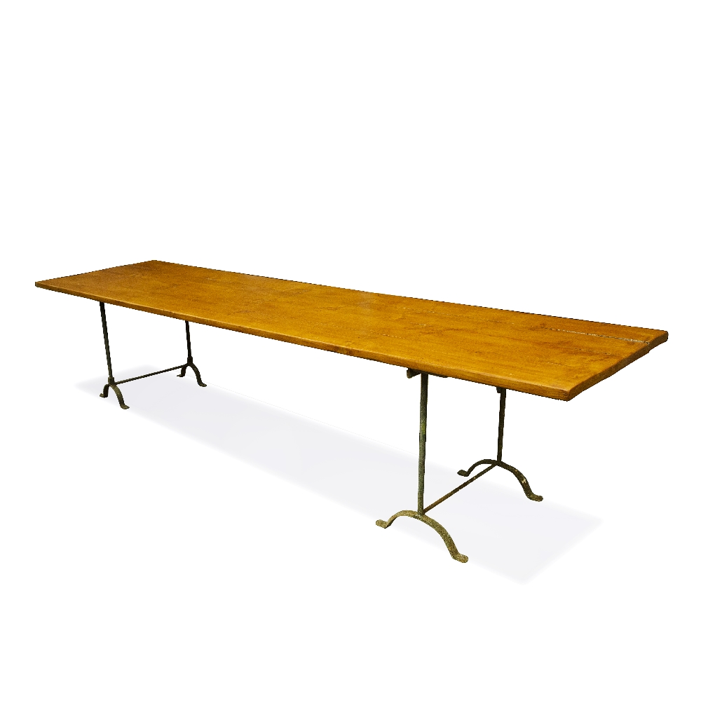 A LARGE TRESTLE TABLE with pine board top and wrought iron supports, 359.5cm long x 89.5cm wide x
