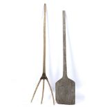 AN OLD WOODEN PITCHFORK 160cm long together with a wooden paddle or shovel, 150.5cm long (2) At