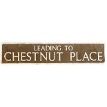 A PAINTED ALUMINIUM STREET SIGN 'Leading to Chestnut Place', 116cm x 23cm Condition: paint chips and