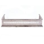 A POLISHED AND PIERCED STEEL FIRE FENDER 76cm wide x 33cm deep x 14cm high At present, there is no