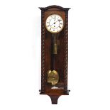 A WALNUT CASED VIENNA TYPE REGULATOR with two part enamel dial, 30cm wide x 95.5cm high Condition: