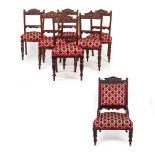 A SET OF SIX CARVED WALNUT PARLOUR DINING CHAIRS with decorative cresting rails, overstuffed