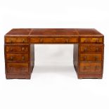 A WALNUT PEDESTAL PARTNERS DESK with a polished top, drawers to one side and cupboards to the