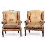 A PAIR OF UPHOLSTERED WING BACK OPEN ARMCHAIRS each 90cm wide x 81cm deep x 107cm high (2)