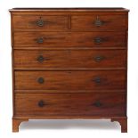 A LARGE SIZE VICTORIAN MAHOGANY CHEST OF TWO SHORT AND FOUR LONG DRAWERS standing on bracket feet