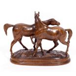 AFTER P.J. MENE two horses upon a naturalistic base, wood carving, 44cm wide At present there is