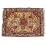 A LARGE MODERN CAMEL GROUND RUG the central field decorated with geometric motifs, vases of flowers,