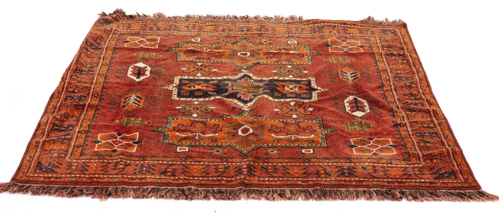 A DECORATIVE RED GROUND RUG 160cm x 132cm together with an old cushion constructed from an - Image 3 of 7