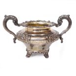 A WILLIAM IV SILVER SUGAR BOWL with embossed floral decoration and coat of arms, bearing marks for