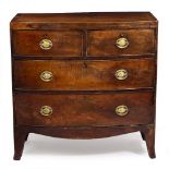 A 19TH CENTURY MAHOGANY BOW FRONTED CHEST OF TWO SHORT AND TWO LONG DRAWERS with brass handles, on