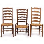 A GROUP OF THREE VARIOUS LADDER BACK RUSH SEATED CHAIRS the largest 415cm wide x 105cm high