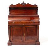 A 19TH CENTURY MAHOGANY CYLINDER BUREAU the raised back with shelf supported on carved scrolls,