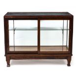 AN EARLY 20TH CENTURY MAHOGANY FRAMED RECTANGULAR DISPLAY CABINET with a sliding door, 117cm wide