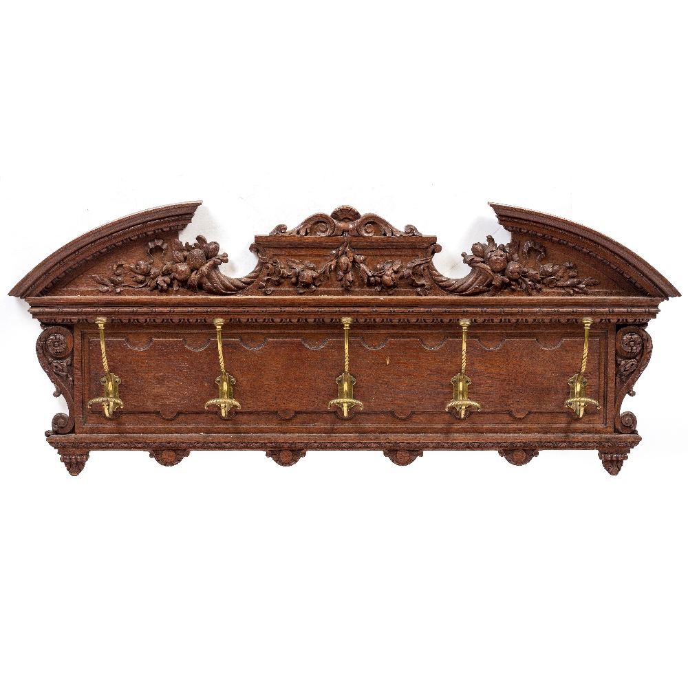 A VICTORIAN OAK WALL HANGING COAT RACK with breakarch pediment and carved cornucopia decoration