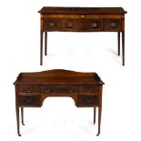 AN EDWARDIAN MAHOGANY FIVE DRAWER WRITING DESK with a galleried top, brass handles, tapering legs