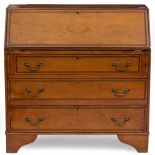 A GEORGE III STYLE MAHOGANY BUREAU with shell decoration to the fall front enclosing pigeon holes