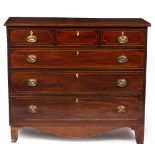 A GEORGE III MAHOGANY CHEST OF THREE SHORT AND THREE LONG DRAWERS standing on bracket feet with