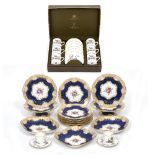 A CROWN STAFFORDSHIRE PART DESSERT SERVICE with a powder blue ground and decorated with floral