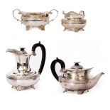 A SILVER FOUR PIECE TEA AND COFFEE SERVICE with ebonised handles on the coffee pot and teapot,