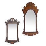 A WALNUT FRET FRAMED WALL MIRROR 55cm wide x 117cm high together with a further fret framed wall