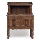 A 17TH CENTURY STYLE OAK COURT CUPBOARD with raised superstructure, term supports and turned