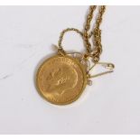 A 1914 GOLD SOVEREIGN with yellow metal mount and chain stamped 375, 18.7 grams in weight overall