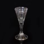 A GEORGIAN STYLE WINE GLASS with conical bowl, stem and conical foot with folded rim, engraved
