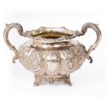 A VICTORIAN SILVER SUGAR BOWL with embossed floral decoration, bearing marks for London 1857, with