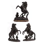 THREE SPELTER FIGURES depicting 'horse tamer', the largest 42cm high x 31cm wide at the base