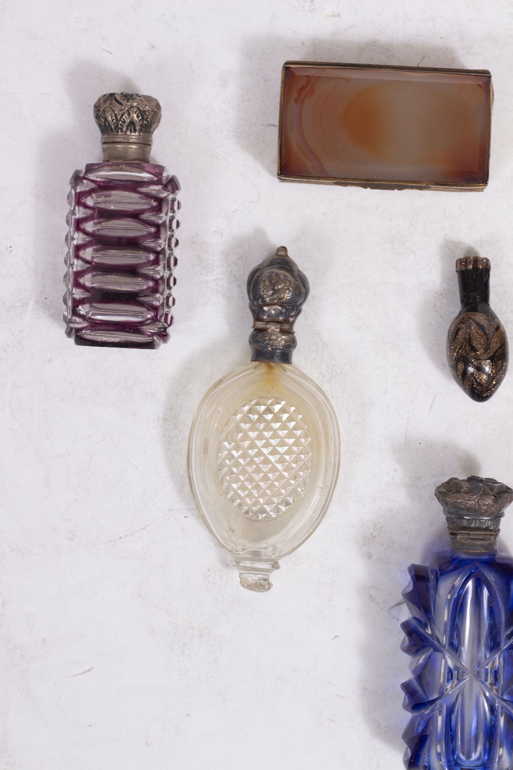 A GROUP OF FIVE VARIOUS GLASS SCENT BOTTLES four with hinged white metal tops together with a pair - Image 4 of 6