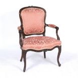 A LOUIS XV STYLE WALNUT FRAMED UPHOLSTERED OPEN ARMCHAIR with scrolling arms and cabriole legs, 66cm