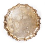 A LARGE SILVER TRAY with a piecrust edge by Mappin and Webb, bearing marks for London 1911, 31.5cm x